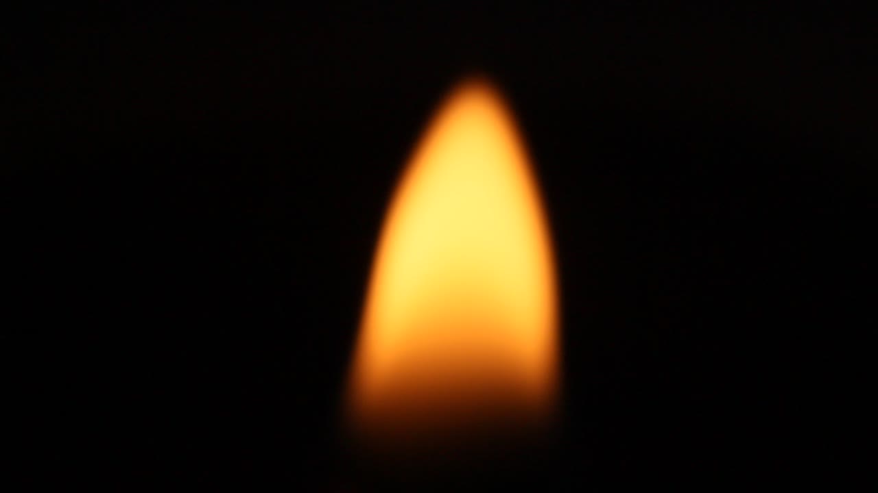 Burning abstract flame on black background.