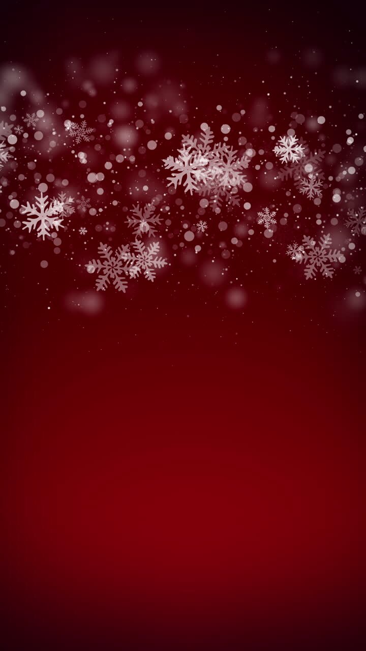 Christmas snowflakes on red background. Glitter frame winter loop motion graphic. Falling snow for holiday invitation. Vertical video.