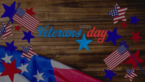 animation of veterans day text over wooden table and american flag