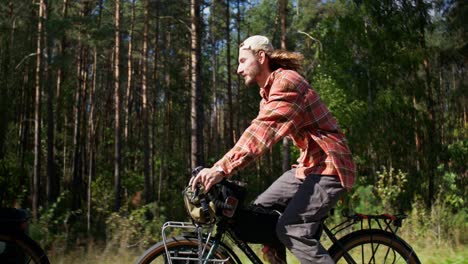 man cycling through a forest