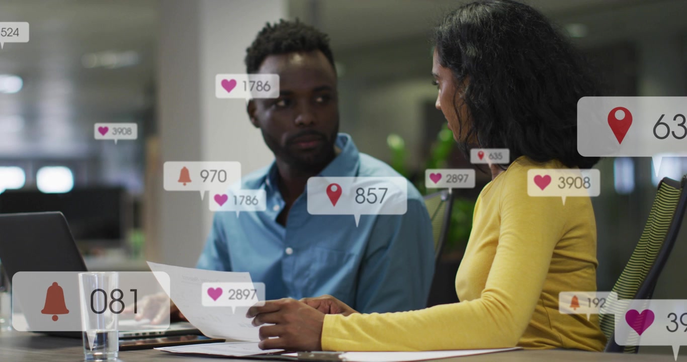 Two Diverse Business Professionals Working in Office with Social Media Overlays