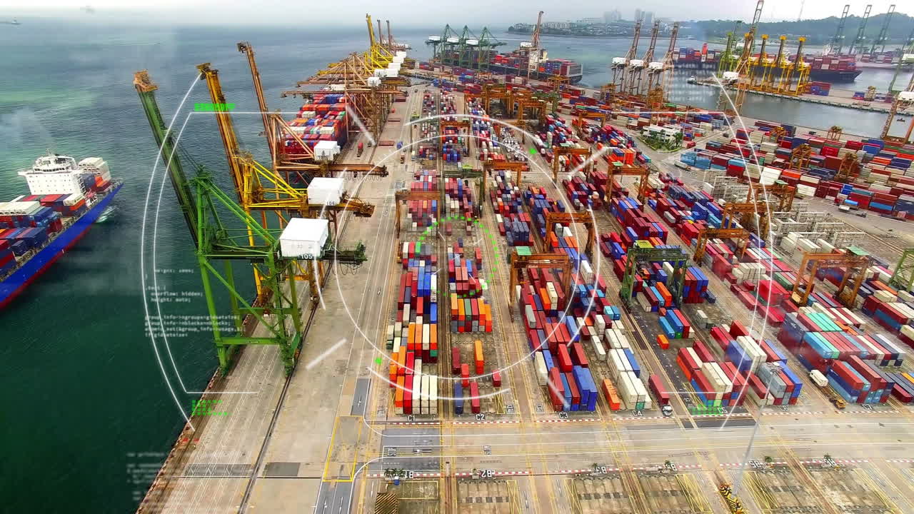Shipping port with cranes and colorful containers, aerial view of busy area