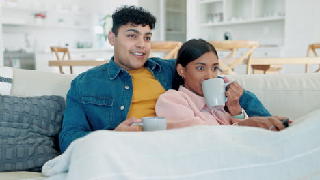 Laugh,-couple-and-watching-tv-while-talking