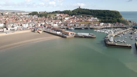 Aerial-bird's-eye-view-of-Scarborough-town,-beach,-harbour-and-castle