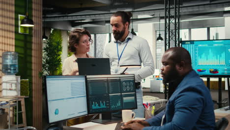 vertical video team of staff members work with high tech and performance metrics