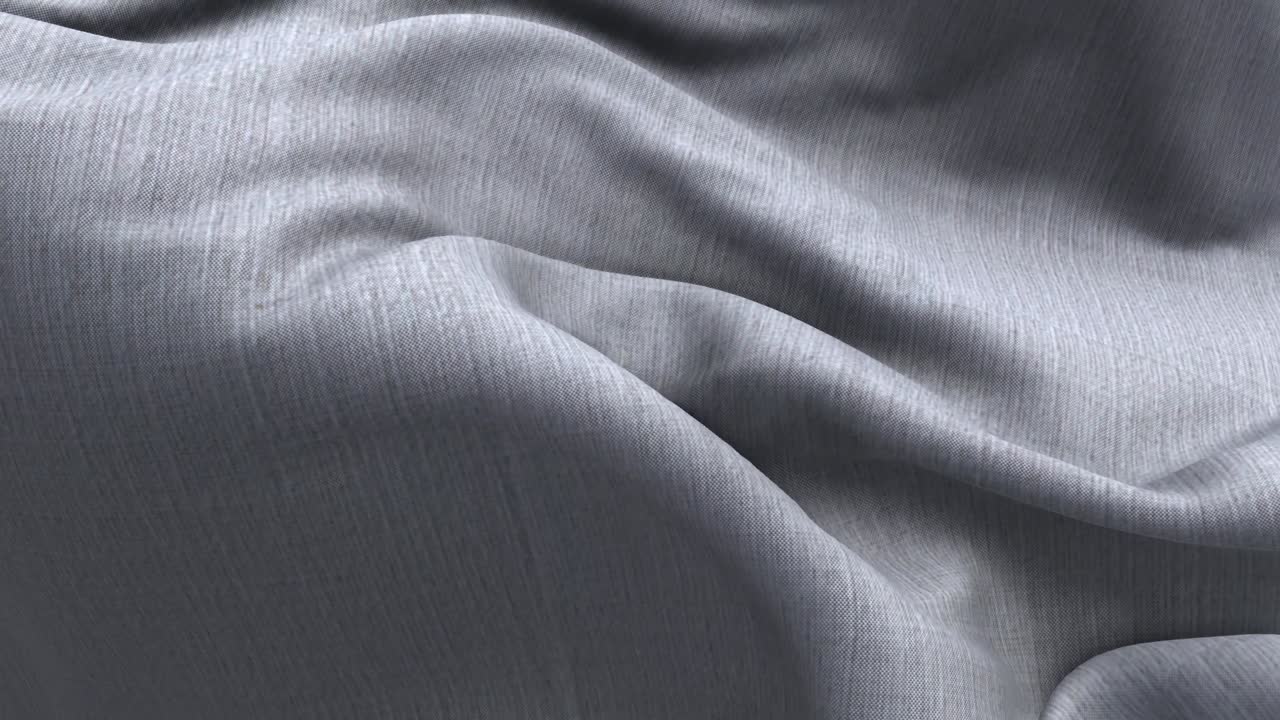 柔軟的灰色布料輕輕飄動與摺疊。