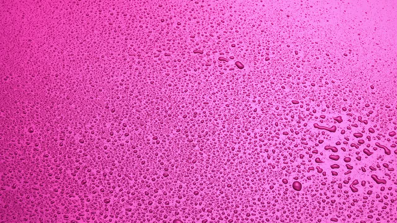 물방울과 함께 추상적인 분홍색 배경