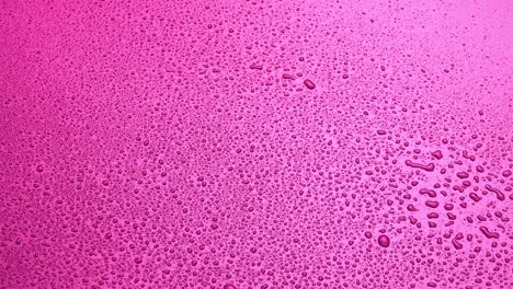fondo de color rosa abstracto con gotas de agua