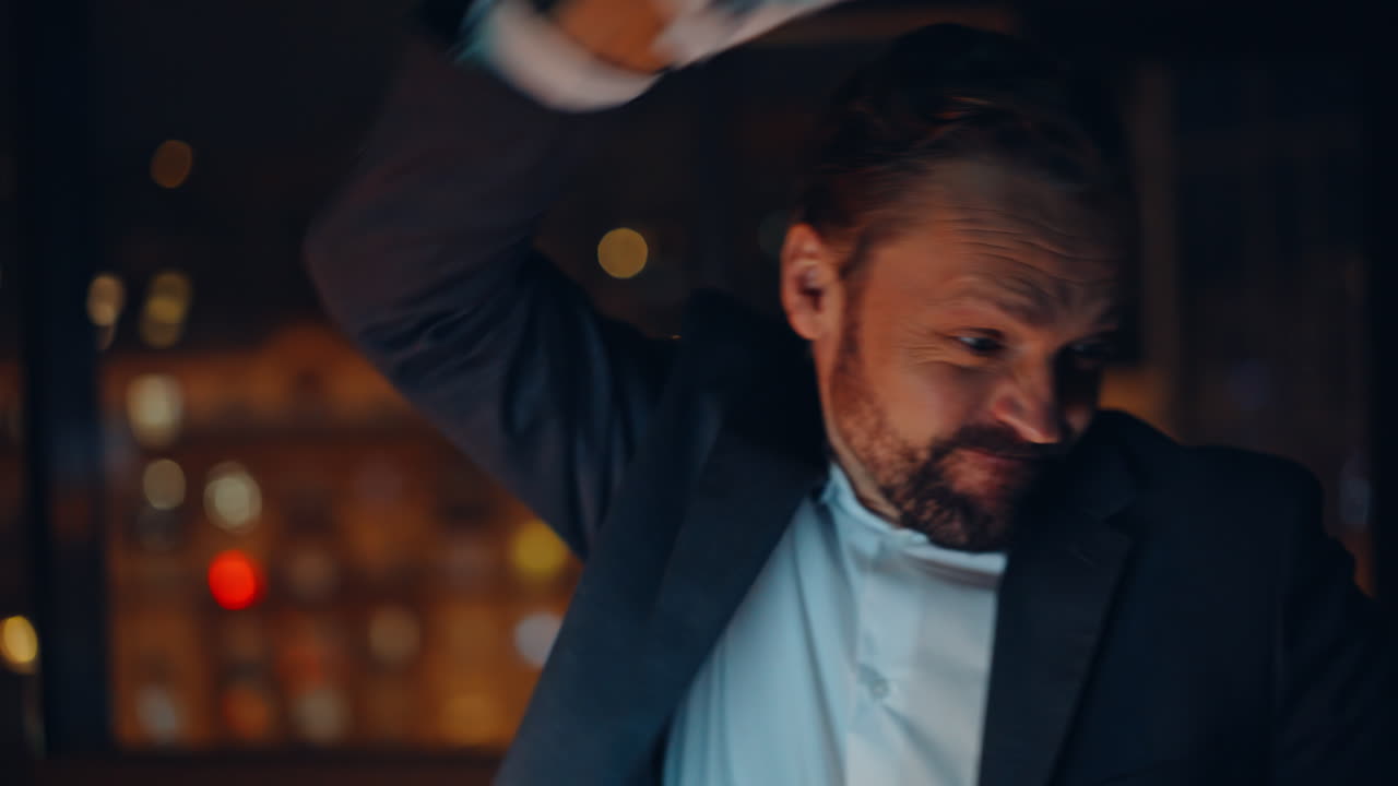 Portrait mad ceo quarrelling videocall night cabinet. Businessman closing laptop