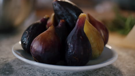 fig bulbs on the elegant white plate indoors, rack focus