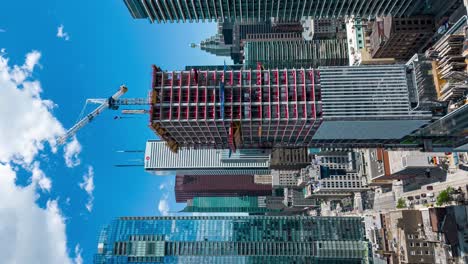 vertical summertime hyperlapse of a construction site in toronto ontario canada