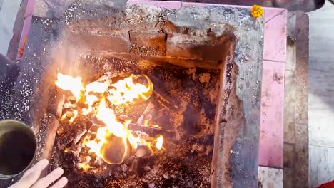 hindu-holy-rituals-with-fire-from-top-angle-at-day-video-is-taken-mahavir-temple-patna-bihar-india-on-Apr-15-2022