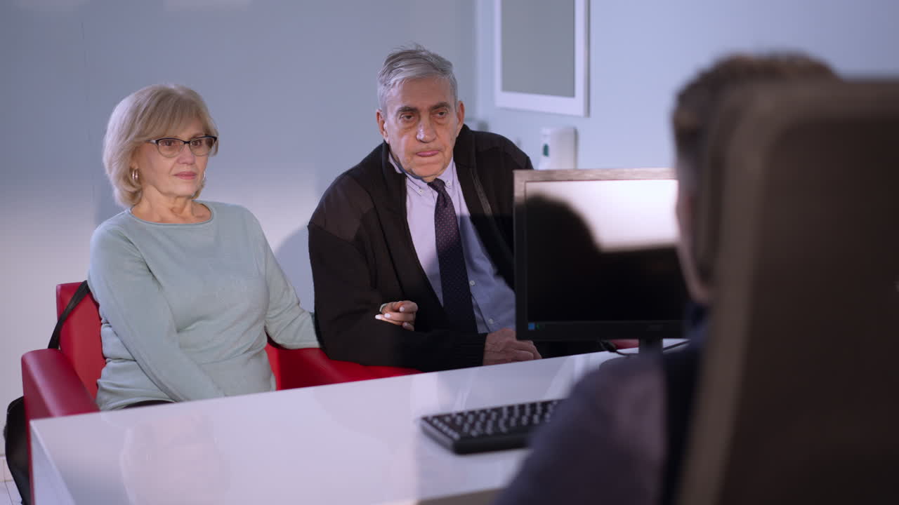 Elderly couple consulting with a doctor