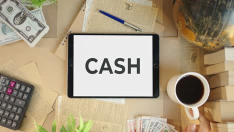 cash displaying on finance tablet screen