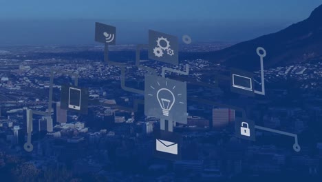 animation of digital flow chart with computer icons over aerial view of cityscape and landscape