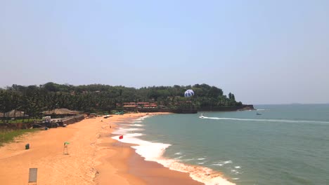 goa sinquerim beach drone shot paragliding bird's eye view