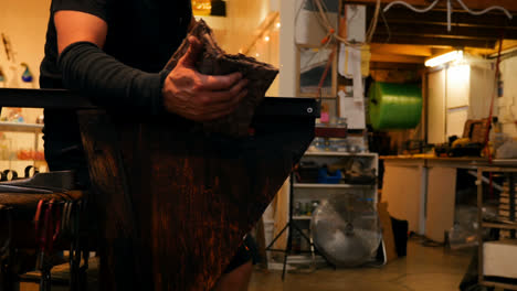 glassblowers shaping a molten glass