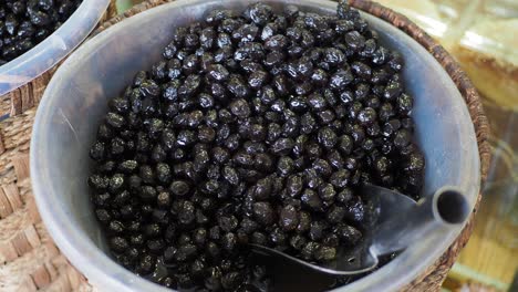 buckets of olives for sale street food market