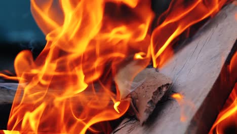 close up of fireplace full of wood and fire. slow motion