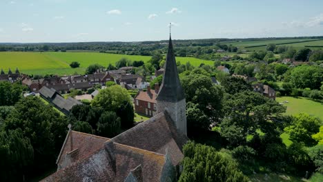 an aerial push-in shot towards ickham village and the st john the evangelist church