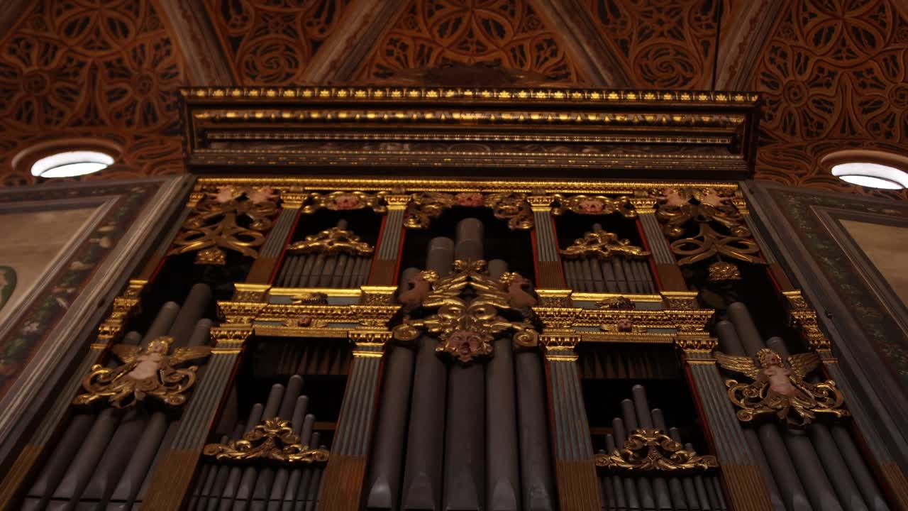 Ornate Pipe Organ and Vaulted Ceiling in a Historic Church