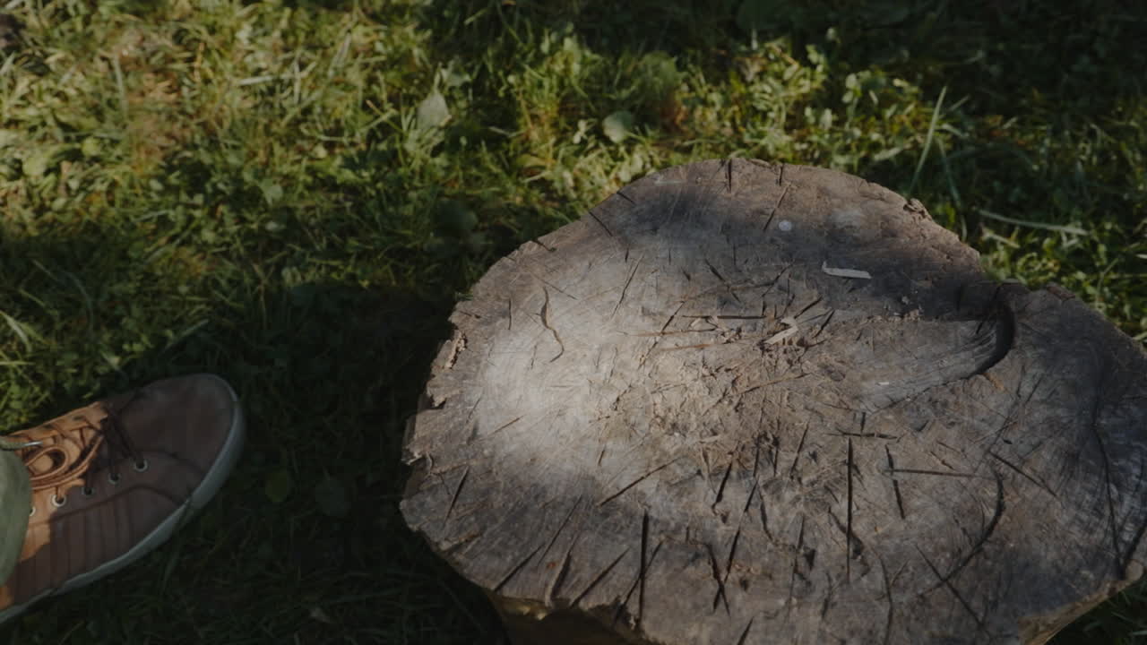 A man picks up the axe