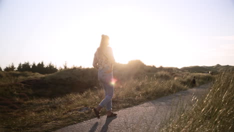 woman walks while sunset in a national park