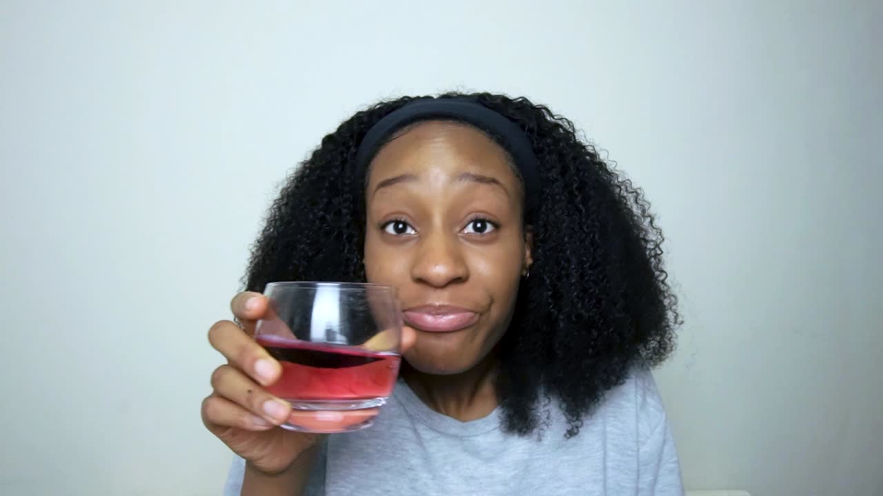 Young Student Listening Intently to Friends Good News On Video Call