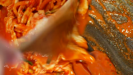 pov to the pot full of korean food -heated kimchi soup