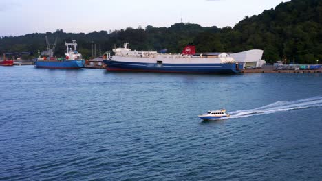 Speed-Boat-Traveling-Near-Port-Of-Balikpapan-In-Kalimantan,-Indonesia---Drone-Shot