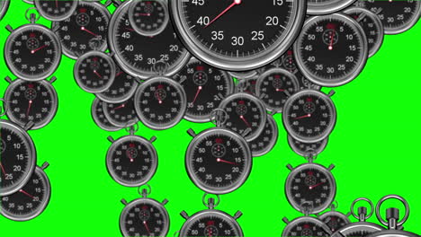 stopwatches falling on green background