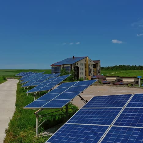 row of solar cells on green grass. photovoltaic panels to generate clean energy in the countryside. solar power station in nature.