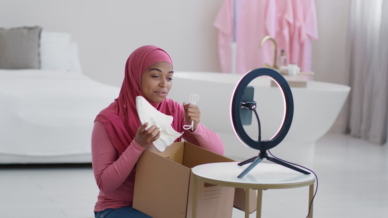 Woman Unboxing and Reviewing Shoes on Social Media
