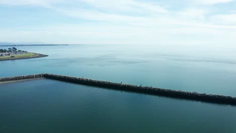 The-breakers-near-the-marina-and-shipping-lanes-on-a-sunny-day