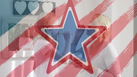 American-flag-design-pattern-and-pulsating-star-over-caucasian-mother-and-daughter-brushing-together