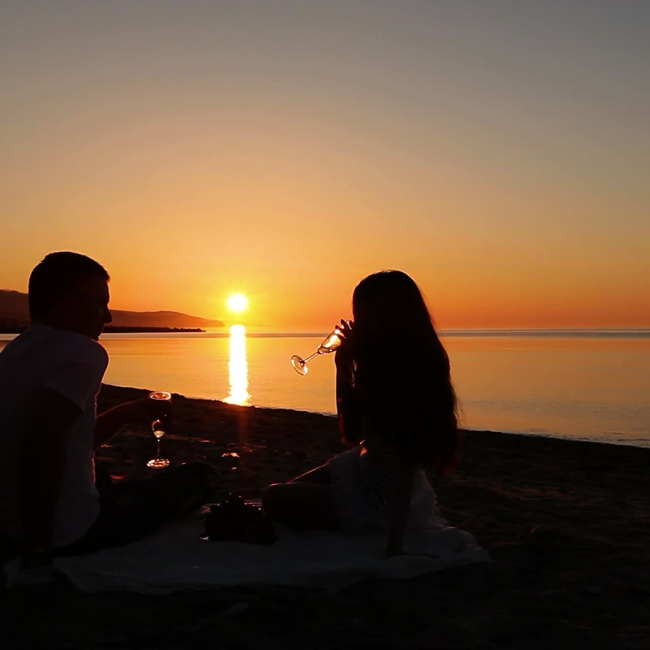 Couple on beach at sunset