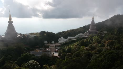 Footage-of-drone-flying-over-the-Temple-Doi-Inthanon-in-Chiang-Mai-in-Thailand-with-the-ocean-in-the-background