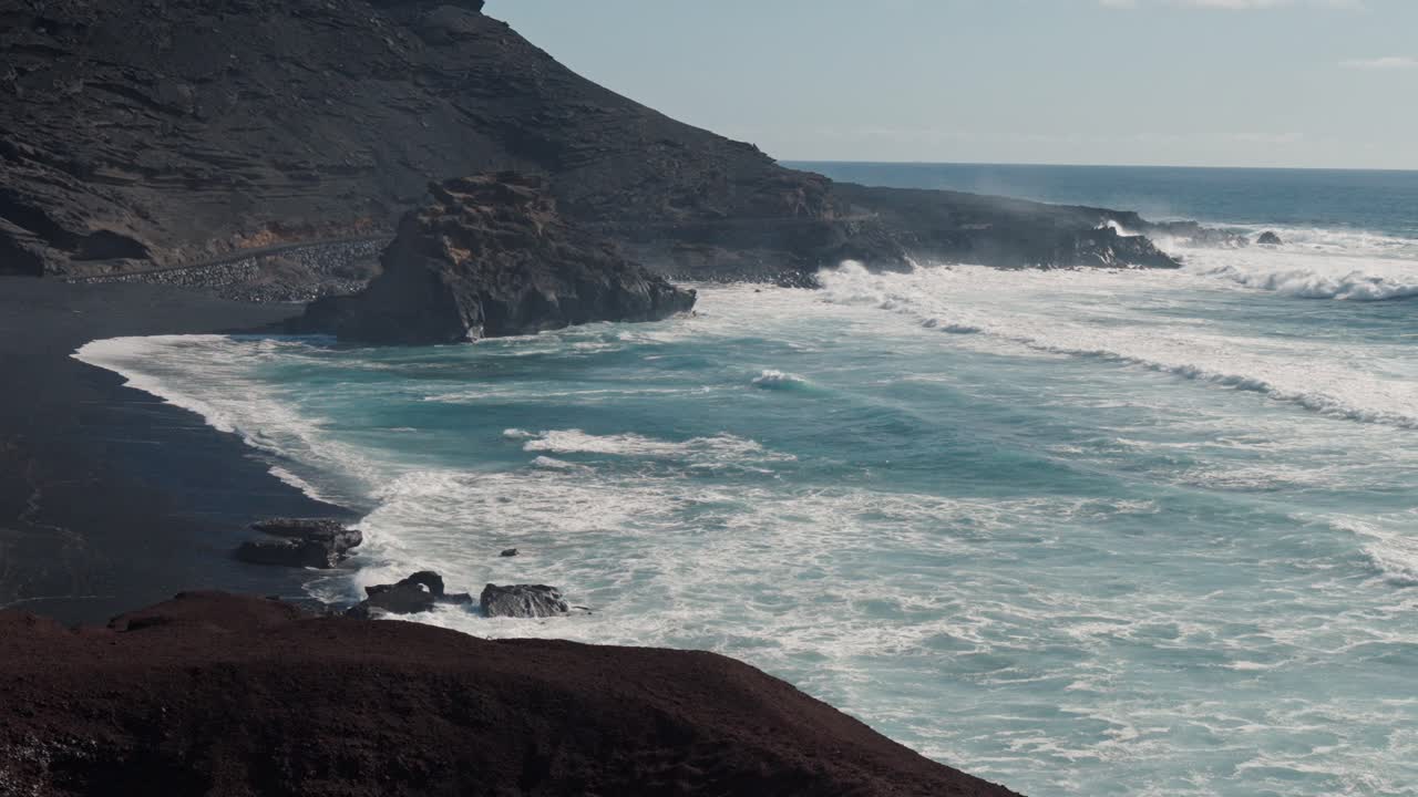 A stunning view of the iconic Green Lake Beach, also known as Laguna de los Clicos, located on the volcanic island of Lanzarote in the Canary Islands, Spain.