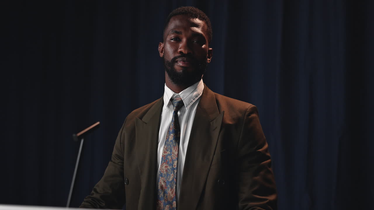 Man in suit giving a presentation