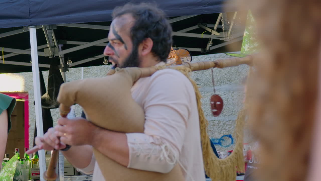 Medieval Bagpiper Playing at a Festival