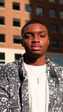 trendy stylish african american man posing confidently in urban fashion with thoughtful expression trendy stylish african american man posing confidently in urban fashion with thoughtful expression