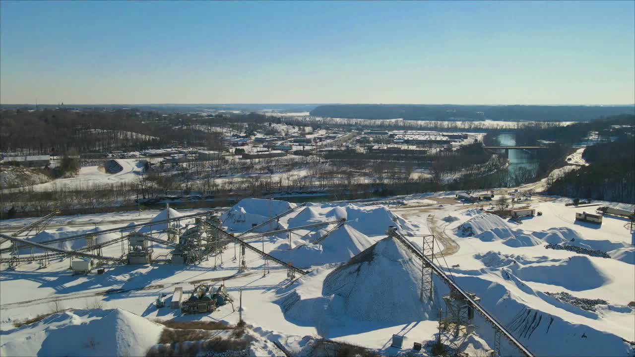 Flying over a limestone quarry in the snow