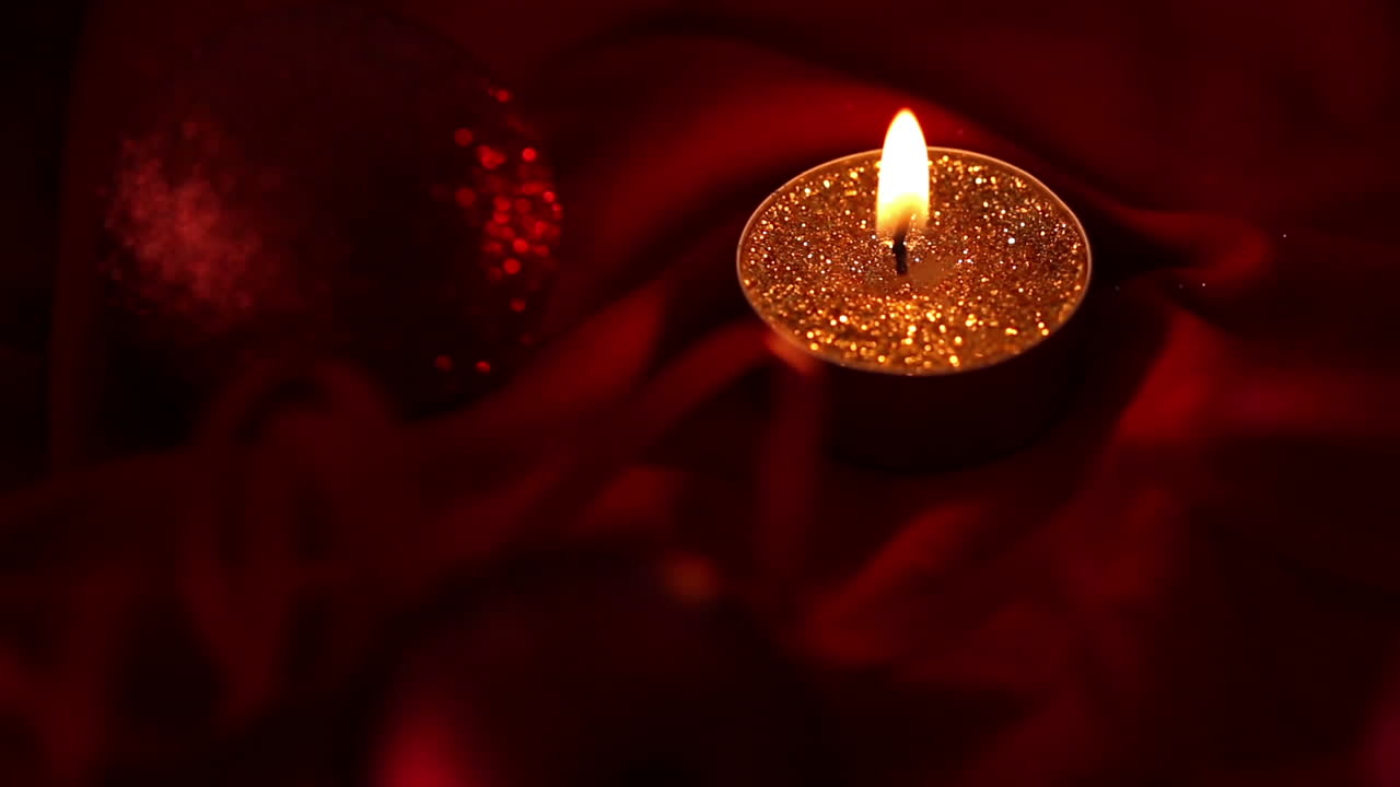 Gold glitter candle flickering and going out
