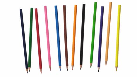 multicolored pencils float in the air