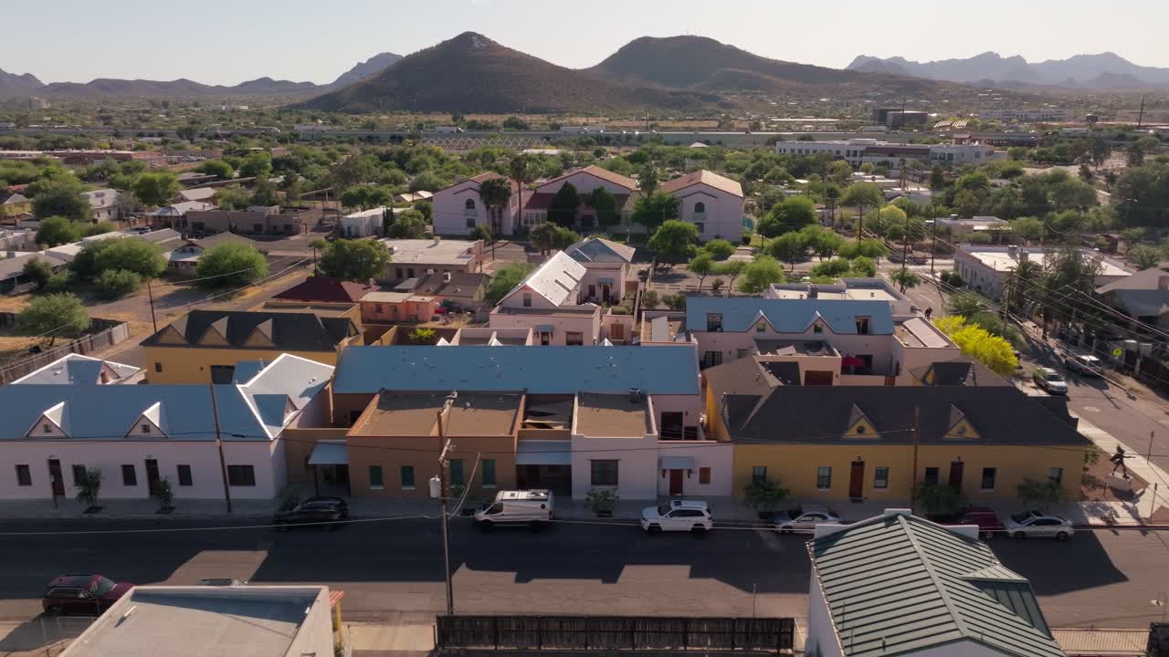 Aerial View of a Residential Area with Houses and Mountains in the Background