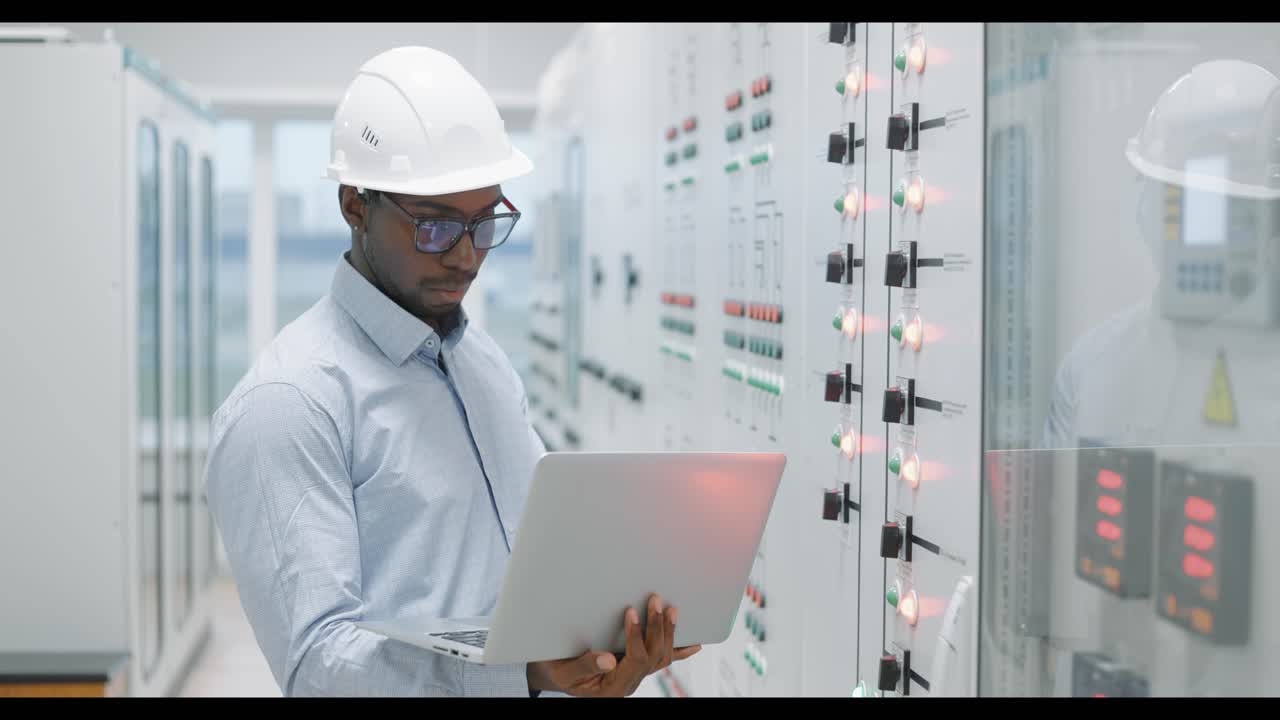 Engineer working on a control panel