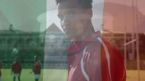 animation of flag of italy over diverse rugby players at stadium