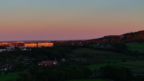 sunset aerial, parallax footage over dutch municipality near german border