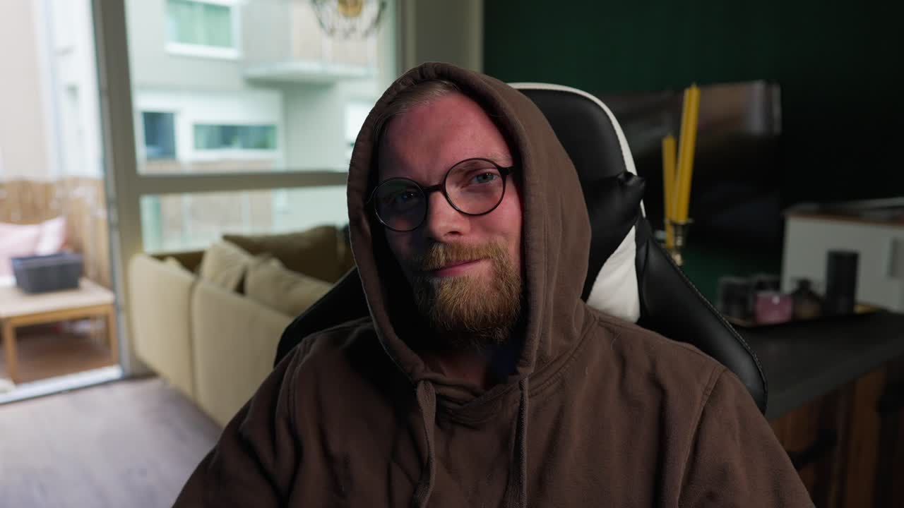 STREAMING - Man turns around and smiles at camera, content creator, slow motion