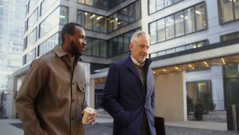 businessmen walking and talking